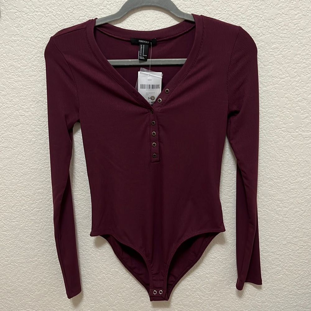 Never worn Forever 21 maroon v-neck long sleeve body suit. Size M. Very soft!